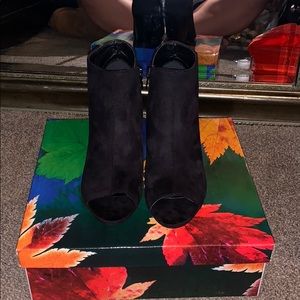 Black open toe boots.